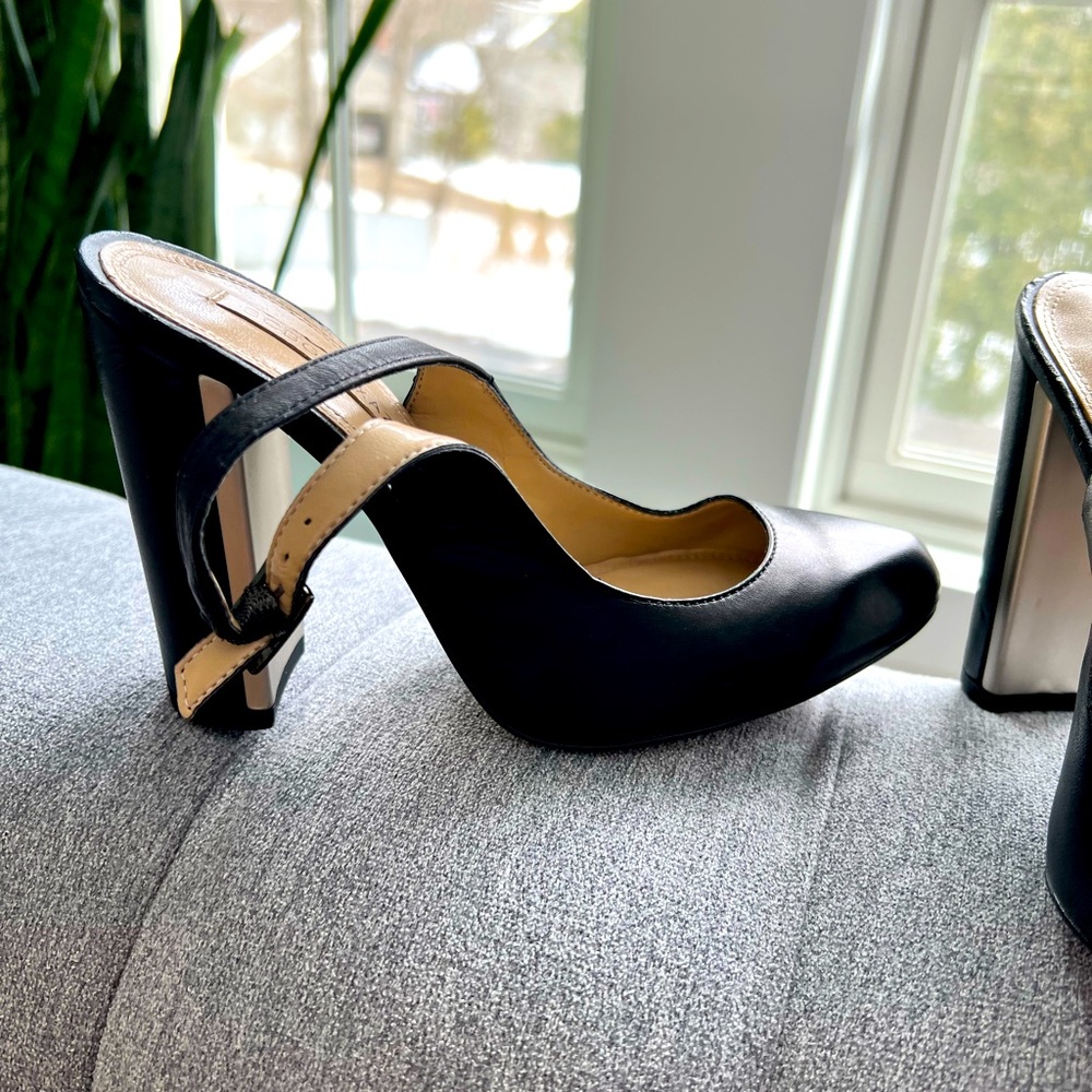BCBG MaxAzria black leather pumps.